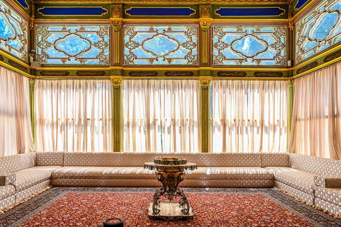 Elegant Ottoman-Style Interior with Traditional Décor and Intricate Stained Glass - Image 1